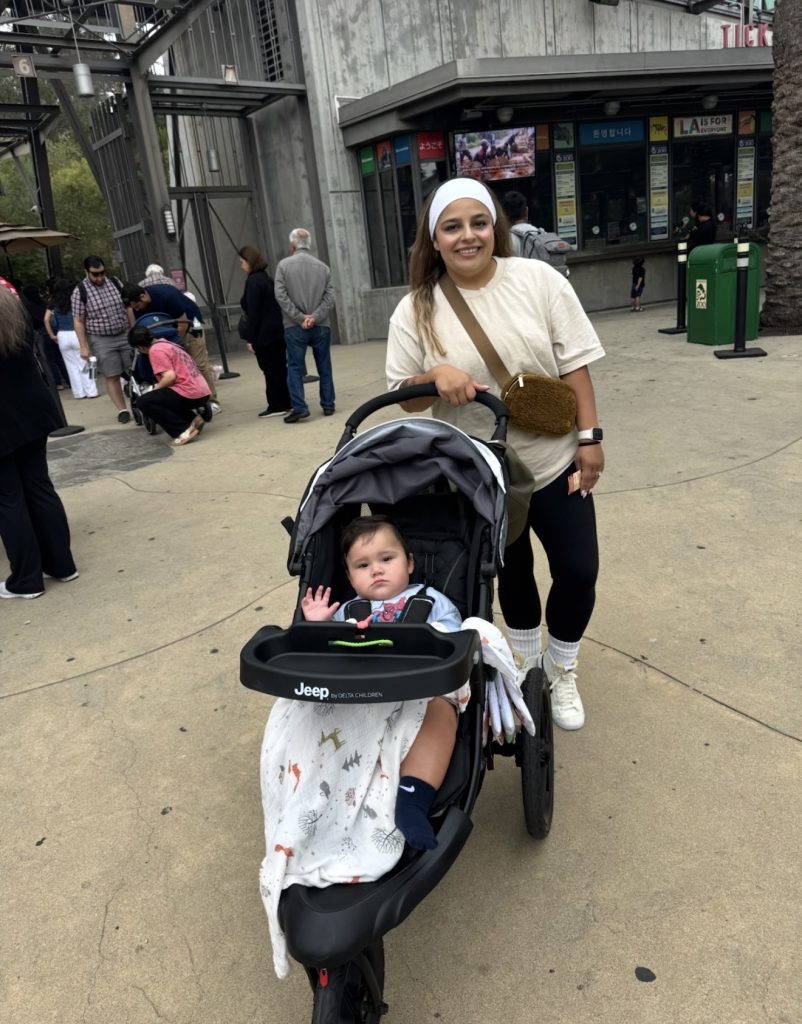 Grandma pushing a baby in a stroller at the Los Angeles Zoo, one of the best things to do with a baby in Southern California